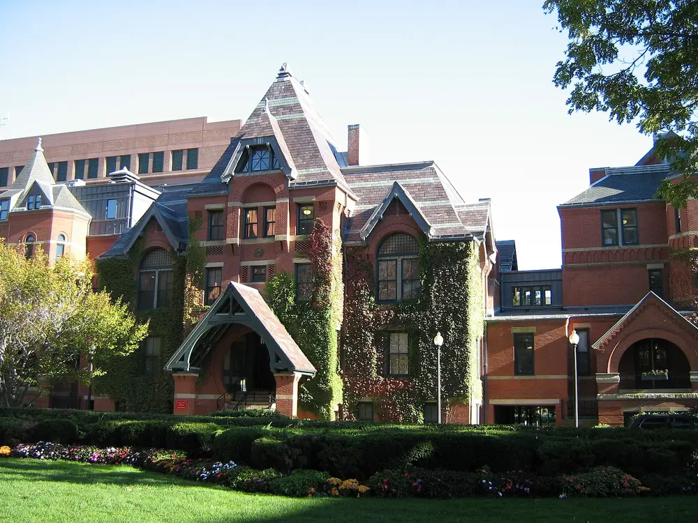 The historic ivy-covered Talbot Building of Boston University School of Medicine on the BU Medical Campus in Boston, MA — the same campus that houses the Henry M. Goldman School of Dental Medicine — under a clear blue sky.