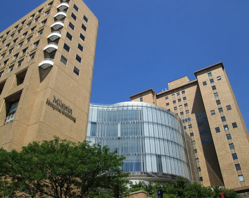 Columbia University Irving Medical Center (Milstein Hospital Building with curved glass facade), the New York academic medical center that hosts Columbia's College of Dental Medicine.