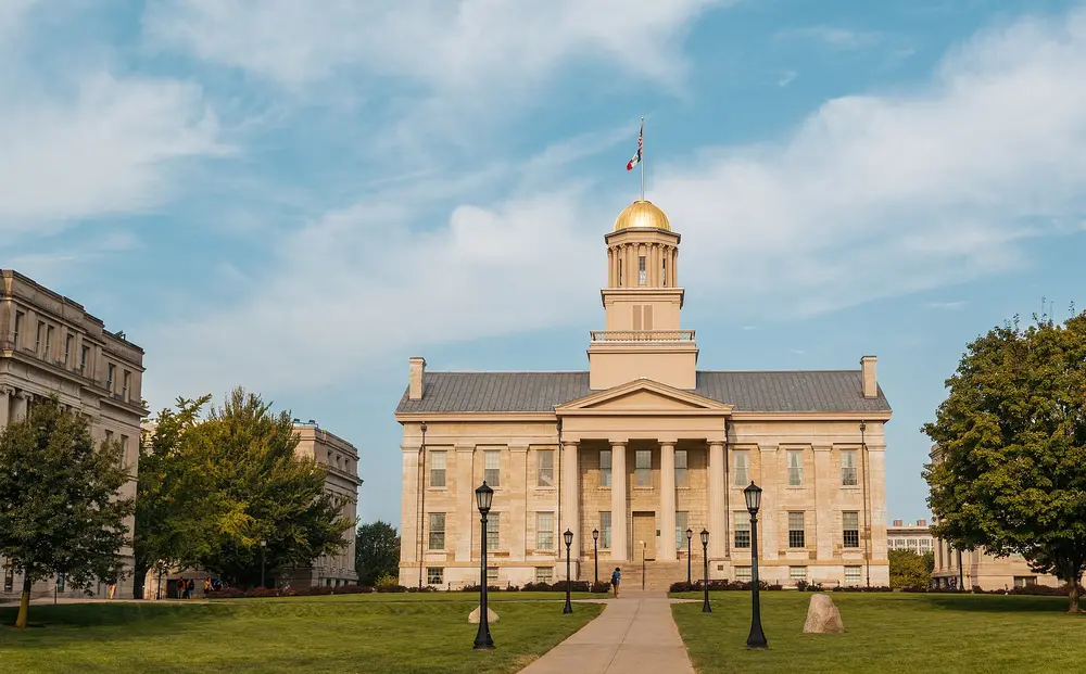 The gold-domed Old Capitol Building on the Pentacrest, the iconic historic centerpiece of the University of Iowa campus in Iowa City — the parent university of the College of Dentistry.