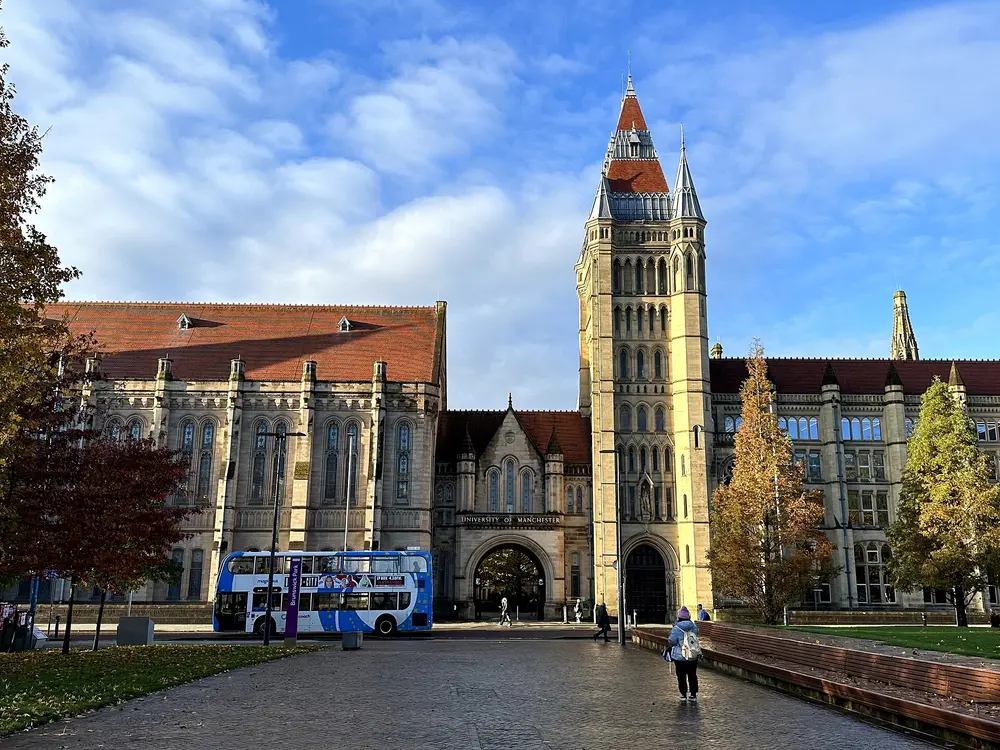 The Whitworth Building main tower and the Queen's Arch of the University of Manchester on Oxford Road