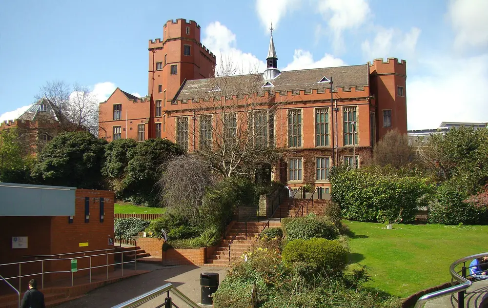 Firth Court, the historic red-brick main building of the University of Sheffield, viewed from the Octagon lawn