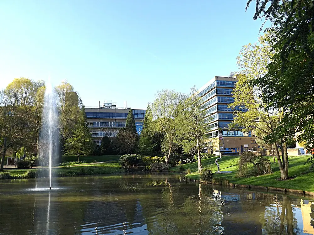 University of Surrey lake and fountain with Senate House and AZ Building, Stag Hill Campus, Guildford