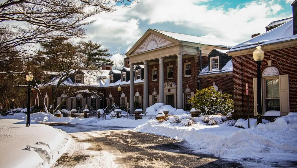 The New York Medical College Administration Building (Sunshine Cottage) — a Georgian red-brick building with a white columned portico — the host campus of Touro College of Dental Medicine at NYMC in Valhalla/Hawthorne, Westchester, NY.